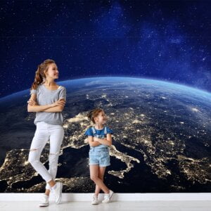 Child looking at Peel and Stick Planet Earth Wall Mural in bedroom