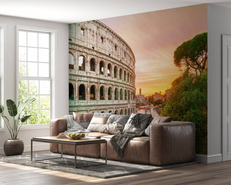 Colosseum illuminated by sunrise amidst greenery on vinyl mural