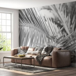 Tropical palm tree design on bedroom wallpaper.